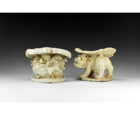Qing Dynasty, 17th-19th century AD. A pair of pale blue glazed ceramic supports comprising: a shield-shaped plaque with flowe