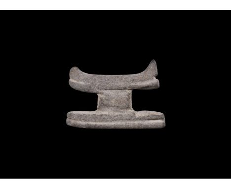 Late Dynastic Period, 664-332 BC. A steatite(?) amuletic model headrest with long pedestal base. Cf. Andrews, C. Amulets of A