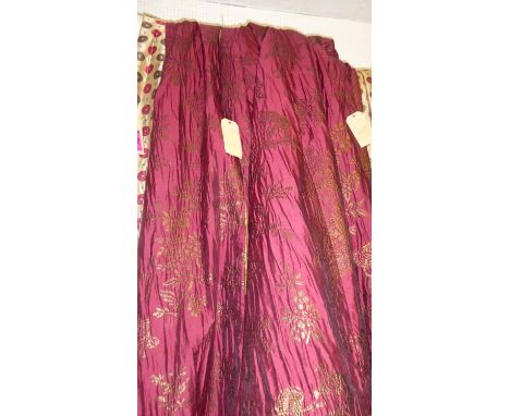 CURTAINS, a pair, in a burgundy and gold Chinoiserie design fabric with gold silk lining, 420cm x 256cm drop. (2)