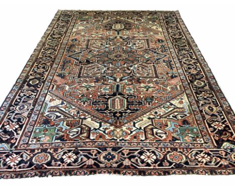 ANTIQUE HERIZ SERAPI DESIGN CARPET, 322cm x 229cm, central pendant medallion within complimentary spandrels and borders.