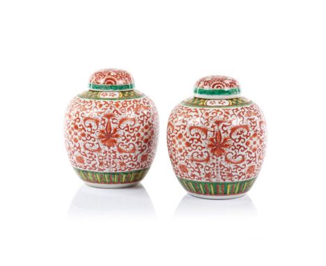 A pair of ginger jarsChinese porcelainPolychrome "Famille Verte" enamelled decoration of lotus scroll motifsBoth marked to un