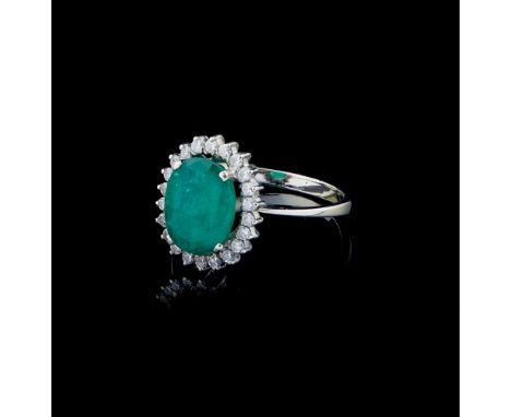 A ringWhite gold 800/000Set with oval cut emerald and 22 8/8 cut diamonds totalling approximately 0,22 ct.Oporto hallmark (19