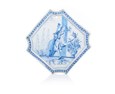 A glazed tileDelft faienceBlue decoration of landscape with flute playerThe Netherlands, 18th century(faults)Provenance: Coll