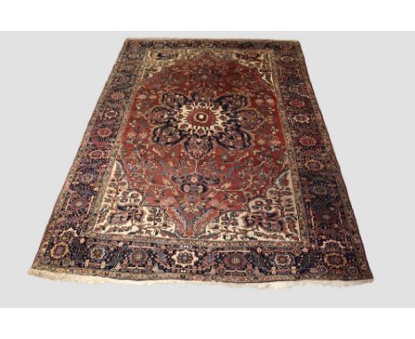 Heriz carpet, north west Persia, circa 1940s-50s, 11ft. 9in. X 8ft. 4in. 3.58m. X 2.54m. Light rose field with large dark blu