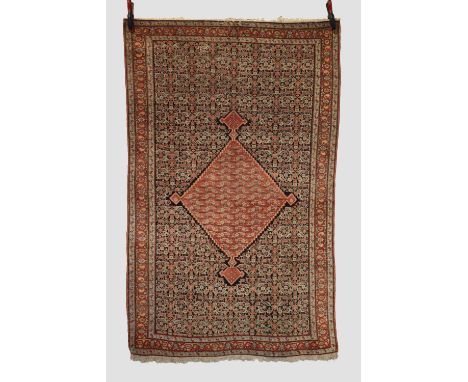 Superb Senneh rug, north west Persia, late 19th century, 6ft. 6in. X 4ft. 2in. 1.98m. X 1.27m. Overall even wear; slight loss