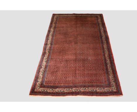 Saraband carpet, north west Persia, circa 1940s-50s, 10ft. 8in. x 6ft. 11in. 3.25m. x 2.11m. Very slight wear in places. Red 