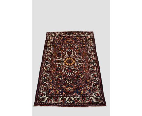 Bakhtiari carpet, Chahar Mahal Valley, west Persia, circa 1940s-50s, 8ft. 6in.x 5ft. 4in. 2.59m. X 1.63m.  Light red field wi