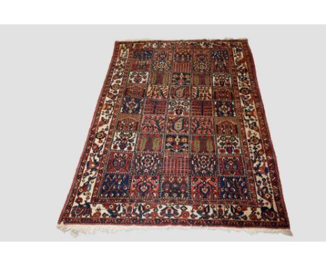 Bakhtiari carpet, Chahar Mahal Valley, west Persia, circa 1930s-40s, 9ft. 10in. X 6ft. 10in. 3m. X 2.08m. Slight wear in plac