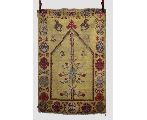 Two Kirshehir rugs, central Anatolia, late 19th/early 20th century, the first a prayer rug, 5ft. 1in. X 3ft. 4in. 1.55m. X 1.