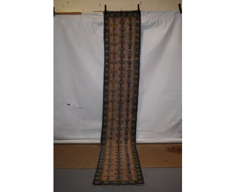 Narrow runner, Moroccan, circa 1960s-70s, 12ft. 10in. X 2ft. 3in.  3.90m. X 0.69m. Overall even wear; surface marks in places