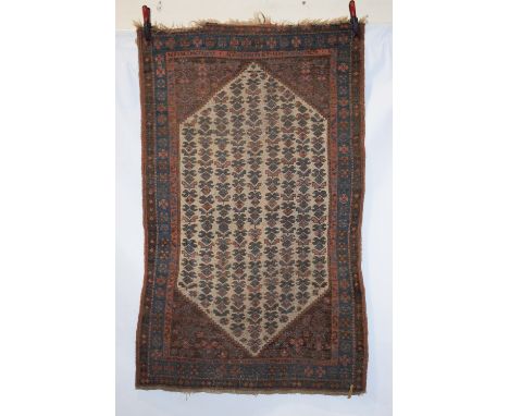 Kurdish rug, north west Persia, circa 1920s-30s,. 6ft. 1in. X 3ft. 8in. 1.86m. X 1.12m. Overall wear and corrosion to dark br