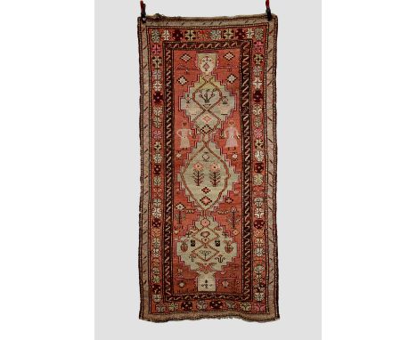 Inscribed Armenian 3-medallion rug, Karabakh district, south west Caucasus, circa 1930s-40s, 8ft. X 3ft. 7in. 2.44m. X 1.09m.