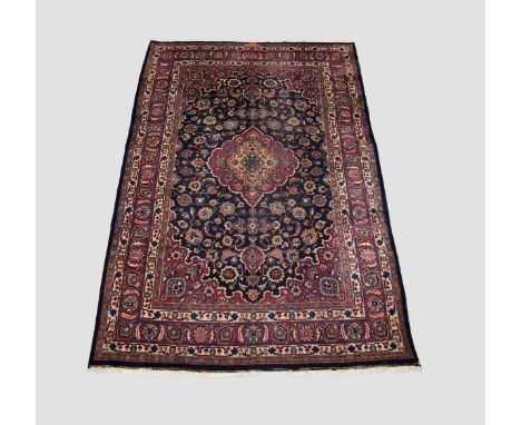 Mashad carpet, signed, Khorasan, north east Persia, circa 1950s, 10ft. 2in. X 6ft. 9in. 3.10m. X 2.05m. Dark blue field with 