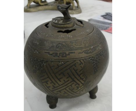 An early 20th century brass spherical shaped censor with dragon finial