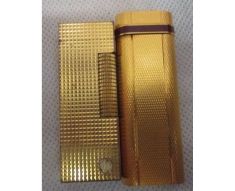A Dunhill lighter; together with a Cartier lighter