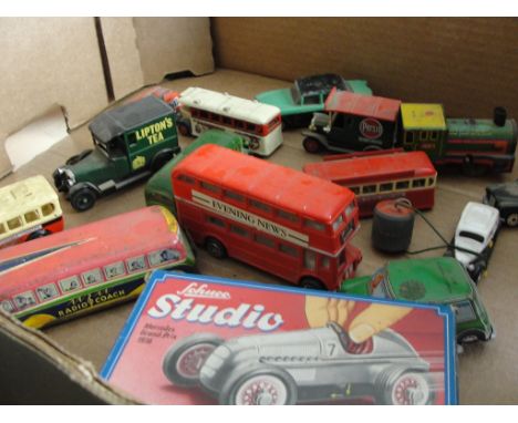 A quantity of vintage tinplate buses; together with a cased Schucho Studio Mercedes, Grand Prix 1976 etc