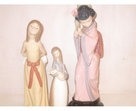Three Lladro figures to inc an Oriental lady, girl holding a  piglet and girl holding a hat
