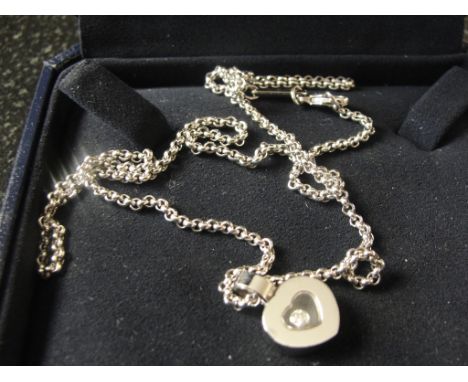 An 18ct Chopard 'Happy Diamond' necklace and chain (boxed with Certificate)