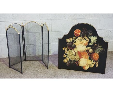 A modern painted fireguard, decorated with fruit; together with a folding spark guard (2)