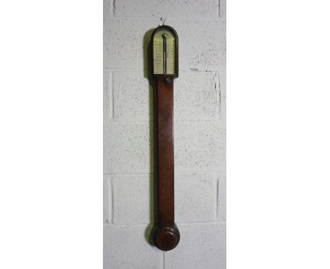 A George III mahogany cased stick barometer, signed F.W.Field, Aylesbury, with a silvered dial with 27-31 scale and adjustabl