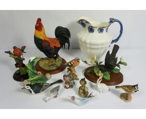 A selection of ceramics, including a large decorative cockerell, assorted other bird figurines, a wash jug, and Caithness gla