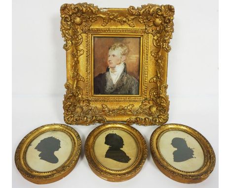 A set of three 19th century silhouettes, each depicting the head of a lady, in oval gilt frames, 13cm x 10cm each; together w