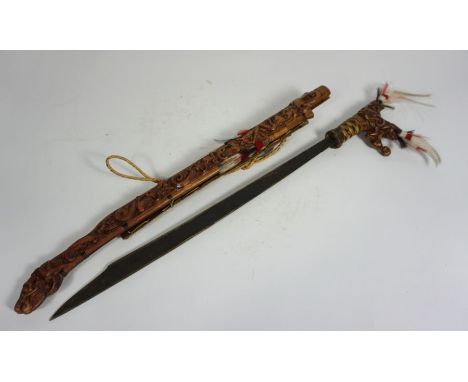 An Indonesian decorative sword and scabbard, with carved figures, modern, 82cm long