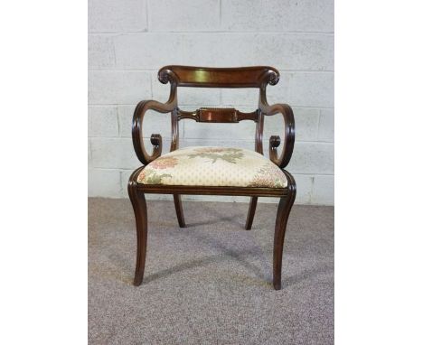 A large George III ladder backed arm chair, 19th century, with a very wide seat, pierced scrolled ladder back, leathered stuf