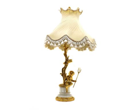 A gilt table lamp,20th century, with a naturalistic stem featuring a cherub holding a trident, on a faux marble socle,41cm hi