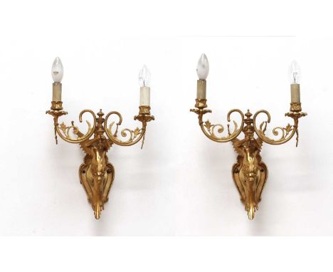 A pair of Empire-style two-branch wall lights,of recent manufacture, French, each of a winged mermaid holding the light aloft