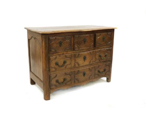 A French fruitwood commode,19th century, of serpentine form with moulded drawer fronts, with three drawers over two long draw