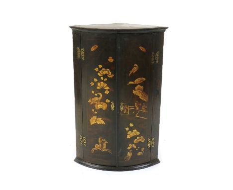 A lacquered hanging bow front corner cupboard,early 19th century, with oriental style raised gilt lacquered birds and figures