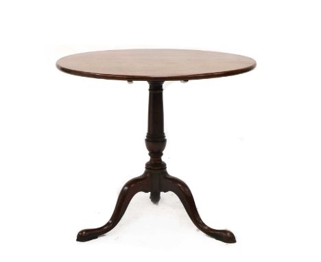 A George III mahogany tripod table,with a tilt top raised on a vase column,83cm diameter73cm highCondition report: Good condi