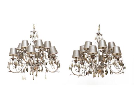 A pair of wrought iron electroliers by Euro Lamp Art,of recent manufacture, each decorated with applied leaves and smoked cry