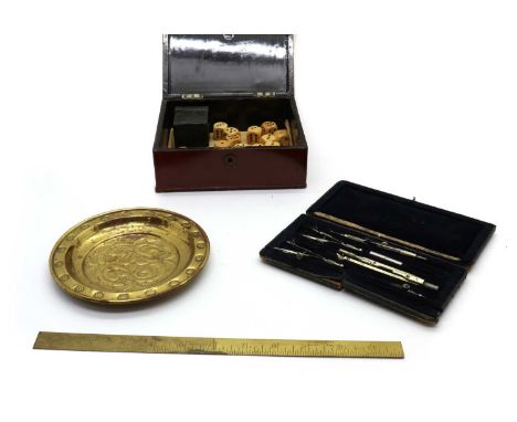 A Chinese lacquered box,the lid depicting two pheasants, containing a quantity of wooden dice, 17.5cm wide15cm deep7.5cm high