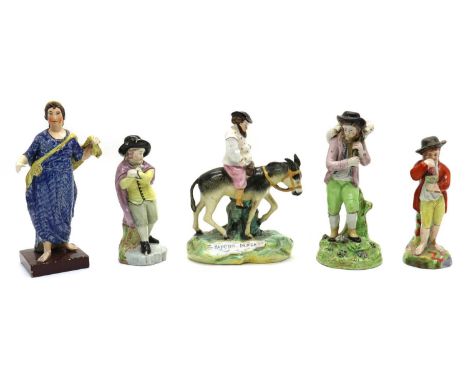 A Staffordshire pottery hollow cast figure,19th century, modelled as a shepherd carrying a lamb,20.5cm hightogether with two 