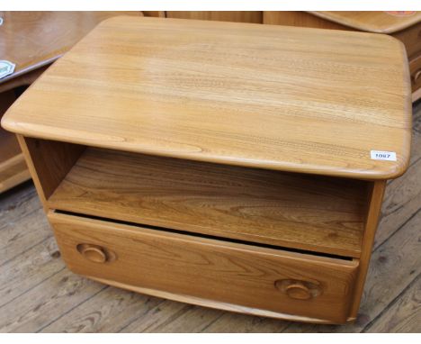 A 1970's light Ercol TV stand with single drawer