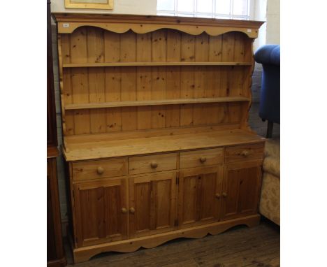 A modern pine shelf back kitchen dresser