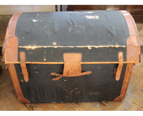 A vintage leather domed top travelling trunk