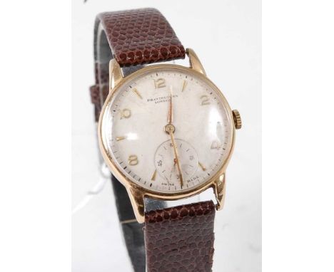 A gent's 9ct gold cased wristwatch by Bravingtons of London, having a signed silvered dial with even Arabic numerals, subsidi