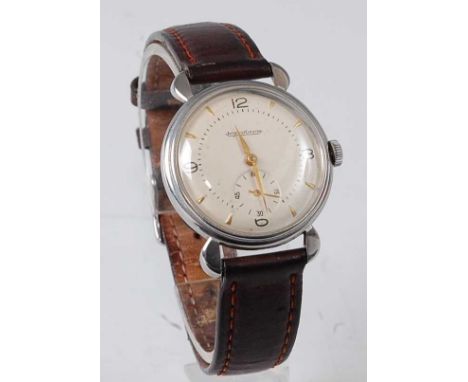A vintage gent's Jaeger LeCoultre steel cased wristwatch, having a signed silvered dial with Arabic quarter numerals and bato