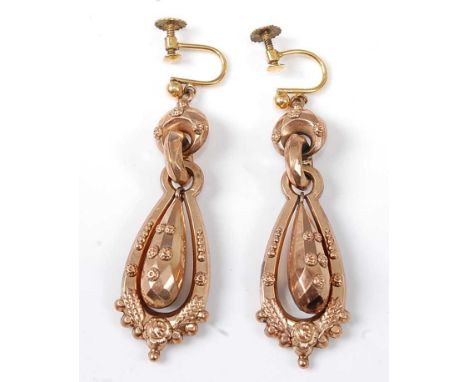 A pair of rose metal hollow articulated ear pendants, each with embossed floral details and rolled gold screw fittings, lengt