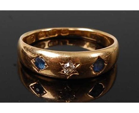 A late Victorian 18ct yellow gold, sapphire and diamond dress ring, featuring a centre Old European cut diamond in a star set