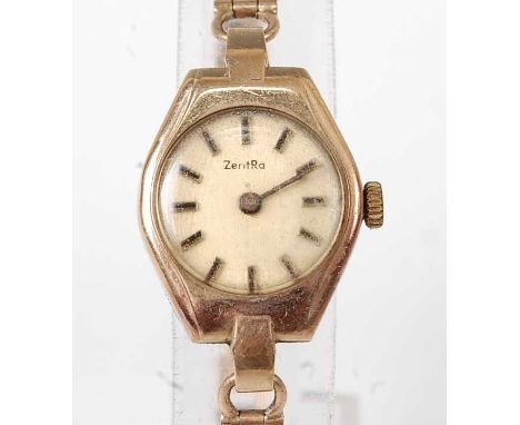 A 9ct yellow gold lady's quartz ZentRa dress watch, having a round cream baton dial within a tonneau shaped case, attached to