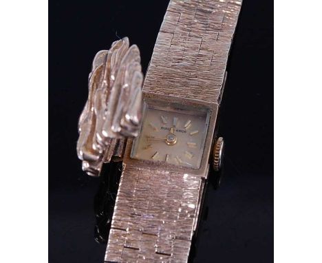A 9ct yellow gold lady's Bueche Girod manual wind wristwatch, having bark finish hinged cover and integral bark finish bracel