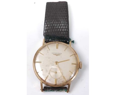 A yellow metal Longines manual wind wristwatch, having a round silver baton dial and subsidiary dial at 6 o'clock, fitted to 