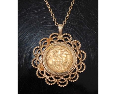 A  George V gold half sovereign within a 9ct gold openwork circular pendant mount, attached to a trace link chain with bolt r