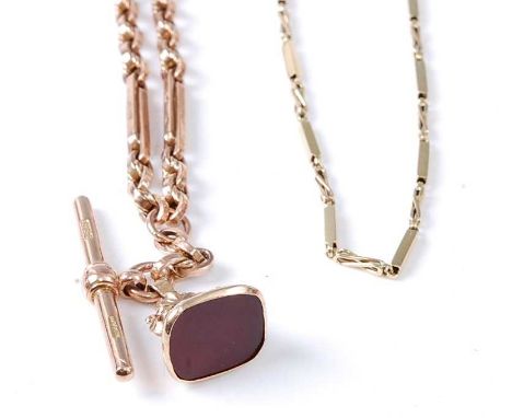 Two Albert chains: A 9ct yellow gold trombone link chain with two swivel clasps and a T-bar with engraved fob set with a 13.5