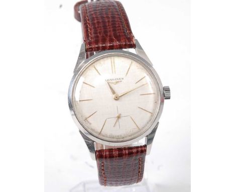 A gent's Longines steel cased wristwatch, having signed silvered dial with baton markers, subsidiary seconds dial, manual win