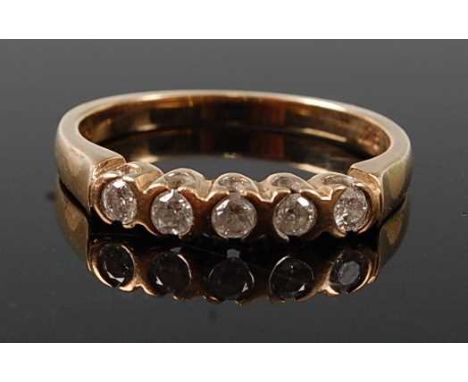 A 9ct yellow gold diamond half hoop eternity ring, featuring five round brilliant cut diamonds in semi-bezel settings, diamon